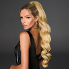 Woman wearing a 27in Hollywood Waves Cinched Pony in Golden Wheat