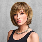 Woman wearing a Flirty Fringe Bob Wig in Glazed Mocha - View from the front