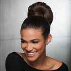 Woman wearing a Glamour Chignon in Chocolate Copper