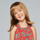 Young girl wearing Pretty In Fabulous Childrens Wig in Buttered Toast - View from the front