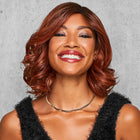 Woman wearing Softly Spiraled Wig in Rooted Dark Copper - View from the front