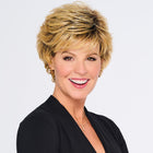 Woman wearing Swept Back Short Cut Wig in Rooted Ginger Blonde - View from the front