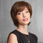 Woman wearing Top It Off With Fringe Topper in Chestnut while slightly turning her body - View from the front